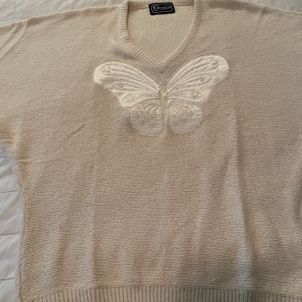 Cream colored sweater buttery soft with Butterfly embellishment